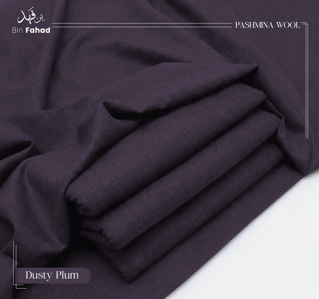 Folded pashmina wool in dusty plum color on a white background
