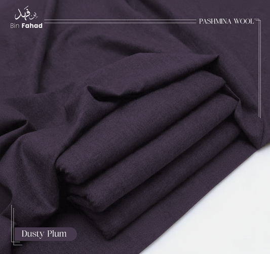 Folded pashmina wool in dusty plum color on a white background